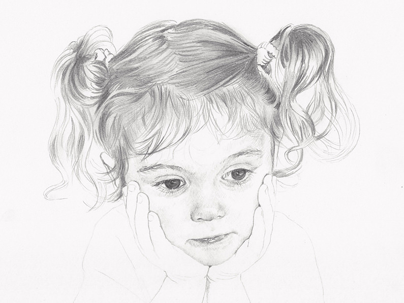 little girl with curly hair drawing